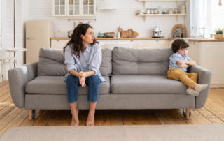 Mom feeling guilty sitting with child
