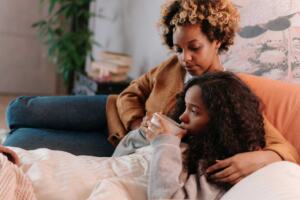 Two-women-comforting-each-other through a miscarriage