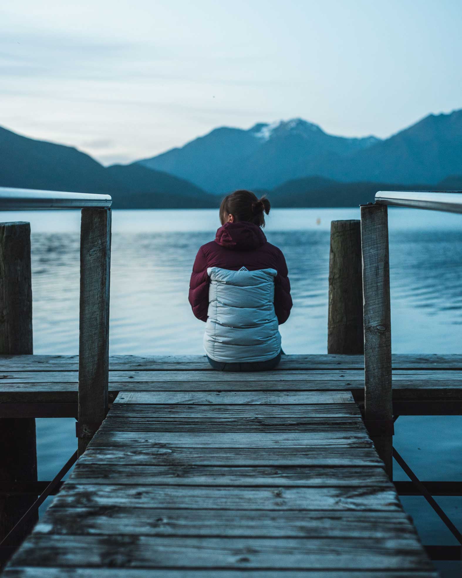 Woman-struggling-with-infertility-sitting-alone-on-a-dock