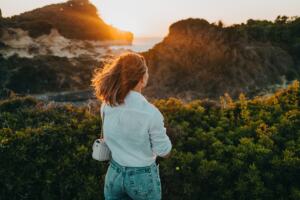 woman looking out at mountains Feeling disconnected from friends